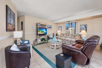 Tiled living room with a textured ceiling