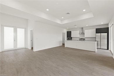 Unfurnished living room with light wood finished f