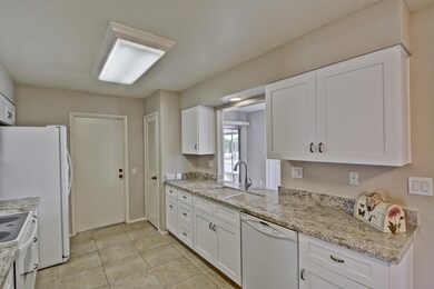 KITCHEN WITH OPENING TO FAMILY RM
