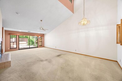 Carpeted spare room featuring baseboards, ceiling
