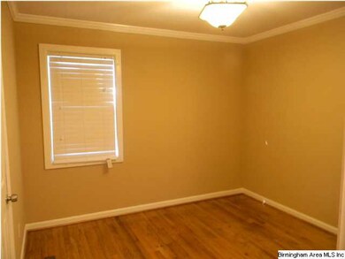 bedroom with hardwood and freshly painted.