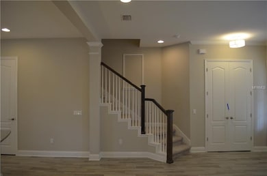 Coat closet and stairway up to 2nd floor.