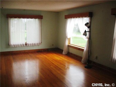Living Room Gleaming Hardwood Floors in the Front 