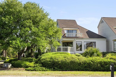 FRONT OF HOME-END UNIT WITH MATURE LANDS