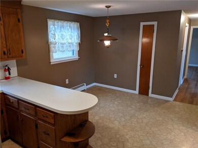 Walk to all the events in downtown Westerly from a convenient rental Ranch at 32 Spring Street just off of Cross Street. The living room opens up to the kitchen and dining room while down the hall are the three bedrooms with nice hardwood floors and a bathroom.  Next to the kitchen is a three season porch with both windows and screens.  The attached garage is part of the unfinished basement. The backyard is perfect for grilling and badminton!  Check it out!