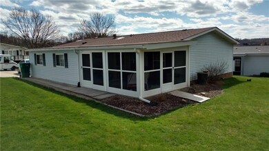 Rear view of yard, and new patio enclosure.