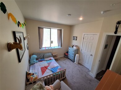 Bedroom with light carpet