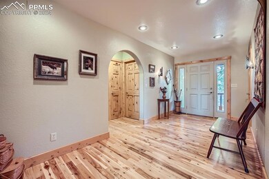 Foyer with light hardwood / wood-style flooring