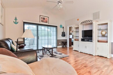 Living room with built in features, vaulted ceilin