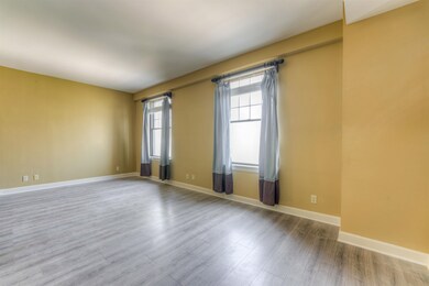 Unfurnished room featuring hardwood / wood-style f