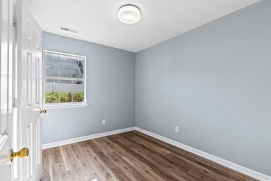 Empty room with light wood-type flooring and a tex