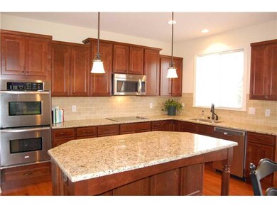 Exterior Front. Large breakfast bar and center island is the perfect place to master those cooking skills!  You ll love the double ovens, 42