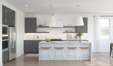 Kitchen with pendant lighting and waterfall island