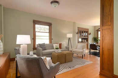 Open floorplan with gorgeous original floors and woodwork