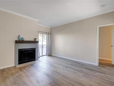 Unfurnished living room with wood finished floors