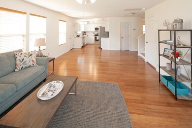 The Den connects with an open area that can be used as a separate breakfast area. The U-shaped Kitchen is in the background giving the owners and family and friends a great space for entertaining while prepping food.