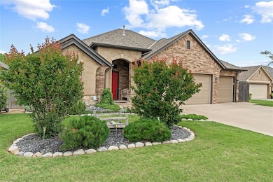 French country style house with an attached garage, concrete driveway, roof with shingles, a front yard, and stone siding