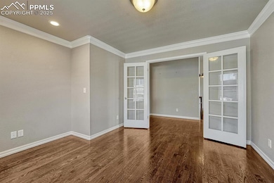 Step into a haven of refinement and efficiency, where french doors, intricate moulding, beautiful wood floors, and subtle recessed lighting create the perfect atmosphere.