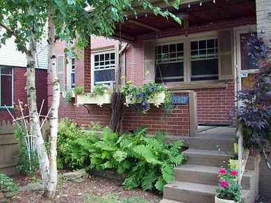 Exterior Front. COZY FENCED COURTYARD