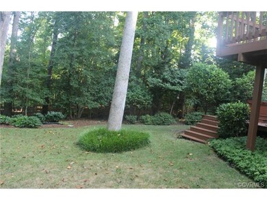 Private rear yard, and koi pod surrounded by lush 
