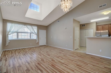 Great Room looking back toward the front door.  Beautiful vaulted ceiling with high windows