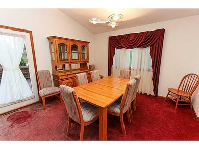 Dining Room.  Doors lead to a beautiful side deck.