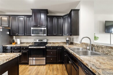 Kitchen featuring appliances with stainless steel
