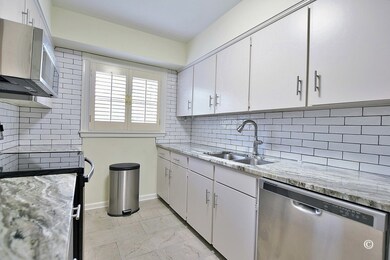 Kitchen with Quartz Counters, Stainless Appliances