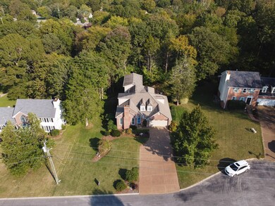 The property line extends well into the woods, so the back yard could be opened up more if needed.