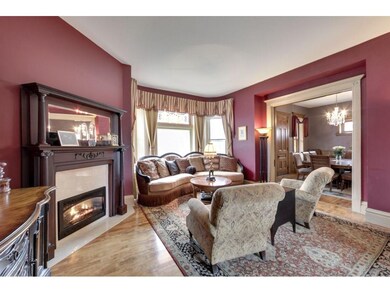 The living room showcases the home's pristine hard
