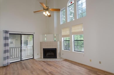 Unfurnished living room with a towering ceiling, 
