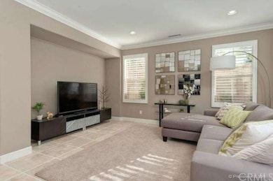 Living room w/Travertine stone floor, crown moldin