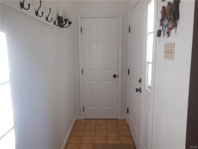 nice size tile foyer with extra coat closet