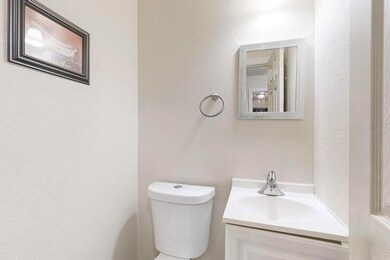 Bathroom with toilet and vanity, half bathroom