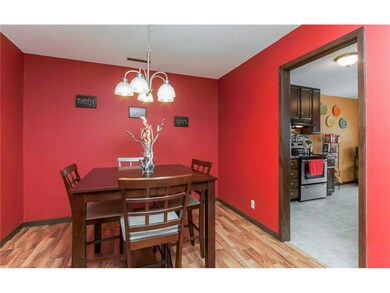Formal dining room with wood laminate floors