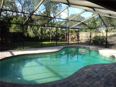Inside the pool cage looking out at the left side 