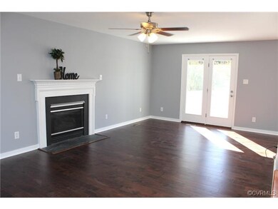 Gorgeous hardwood floors with gas fireplace.