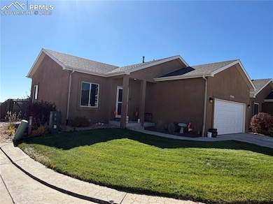 View of front of property with stucco siding, an attached garage, a shingled roof, and concrete driveway