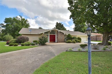 Striking contemporary curb appeal with circle driv