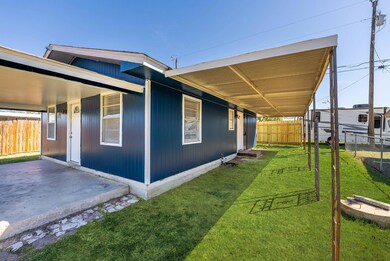 View of yard featuring a patio and fence