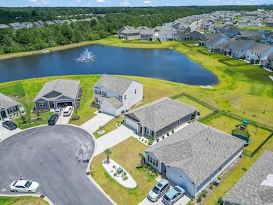 Aerial view of residential area featuring a large body of water