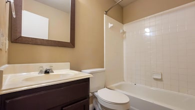 Bathroom with vanity, toilet, and washtub / showe