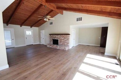 Large Living Area with brick fireplace.  High end 