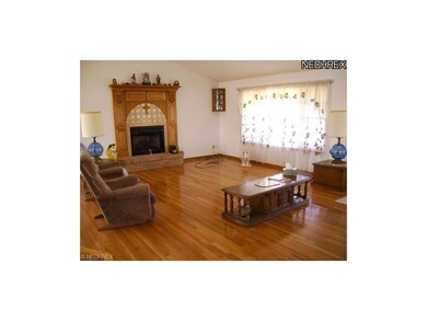 Greatroom with beautiful hardwood floors and stone