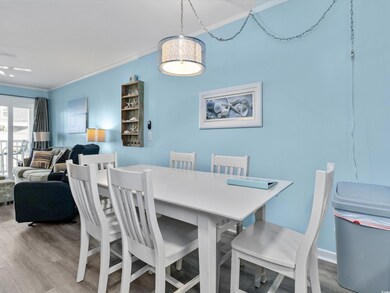 Dining room featuring ornamental molding and wood 