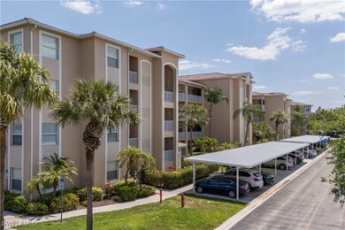 View of property featuring covered parking