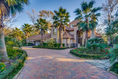 All of the home siding was replaced with stucco. The porte cochere and 4th garage were added, along with this paver stone driveway.