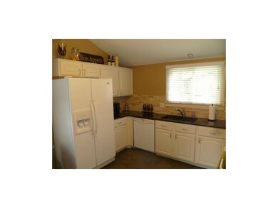 Cozy kitchen offers plenty of counter and cabinet 
