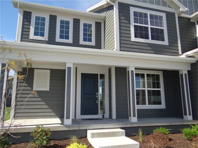 Enjoy a covered front porch at the entrance of thi