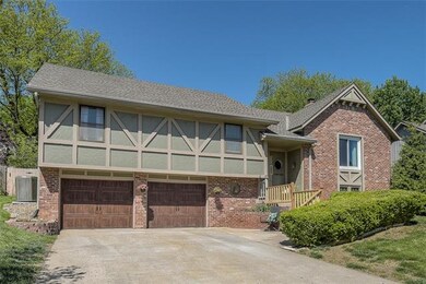 Enjoy the flat driveway and new carriage garage do